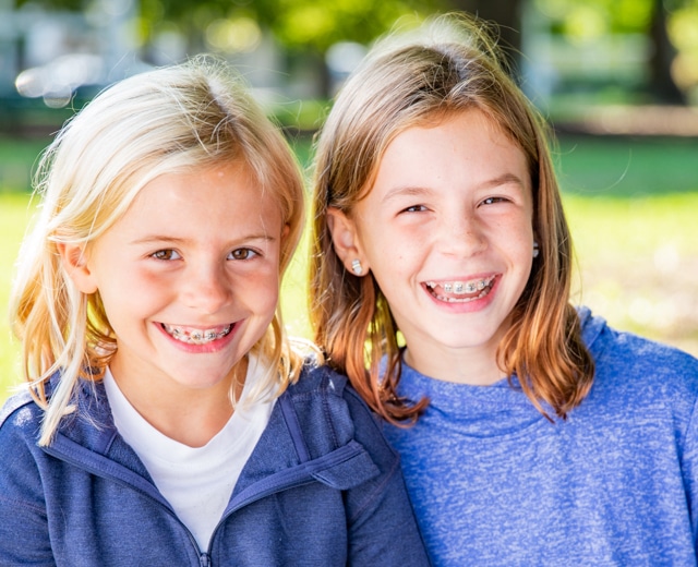 Girls smiling with braces Rehil Orthodontics in Woodland Hills, CA